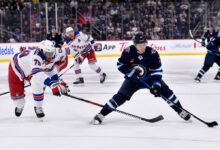 Four Winnipeg Jets players practise with neck guards in wake of Adam Johnson’s death