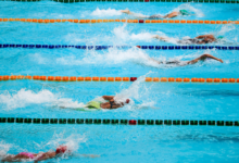 College swimmer stripped of title after celebration