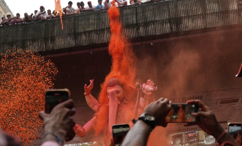 Photos show Indians marking final day of Ganesh Chaturthi that ends with sea immersion